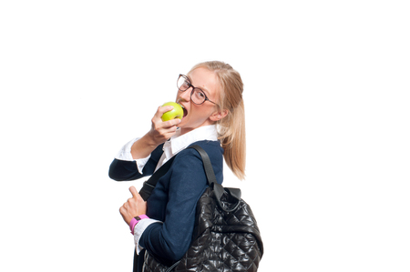 Happy young student girl with backpack, high school or college graduand, standing isolated on white background. Back to schoolの写真素材
