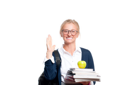 Happy young student girl holding books, high school or college graduand, standing isolated on white...
