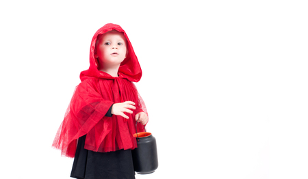 Little Red Riding Hood. Beautiful little girl in a red raincoat with a hood. Happy Halloweenの写真素材