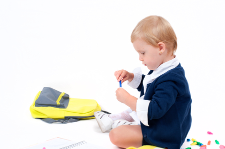Happy little schoolgirl. Child with backpack and books. Back to school. の写真素材