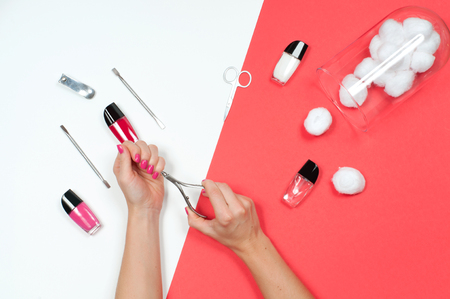 Nail care and manicure. Beautiful female hands with pink manicureの写真素材