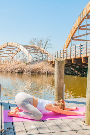 Young woman practicing yoga. Concept of calm and meditation.の写真素材