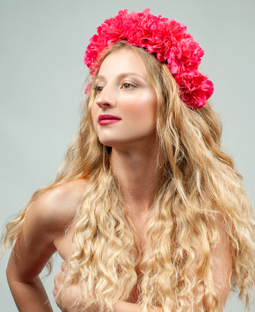 Beautiful romantic young woman with wreath of flowers. Virgo Zodiac Signの写真素材