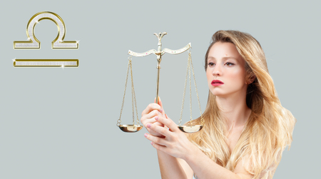 Libra Zodiac Sign. Astrology and horoscope concept. Beautiful woman with long hairの写真素材