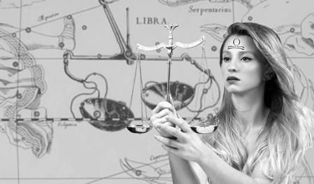 Libra Zodiac Sign. Astrology and horoscope concept. Beautiful woman Libra on zodiac mapの写真素材