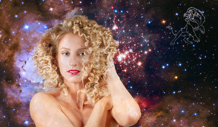 Leo Zodiac Sign. Astrology and horoscope concept, Beautiful woman Leo on the galaxy backgroundの写真素材