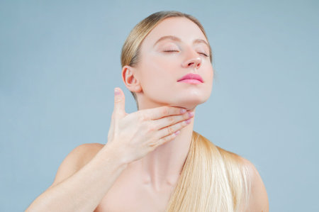 Beauty and facial treatment. Beautiful woman with clean perfect skin touch own face