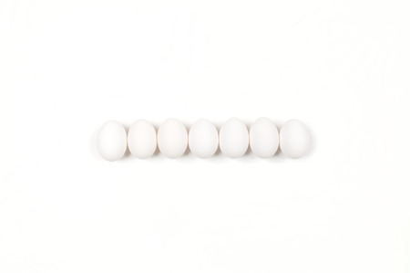 White egg. Raw eggs on white background. Concept happy easter.の写真素材