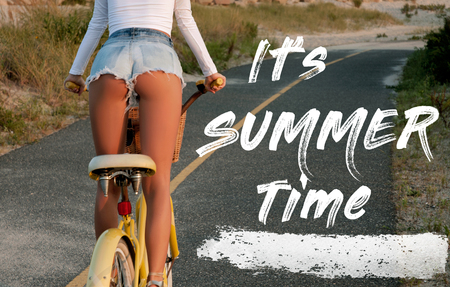 Woman with bicycle riding on beach having fun and smiling. Sea background with lettering it's summer time.の写真素材