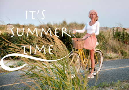 Woman with bicycle riding on beach having fun and smiling. Sea background with lettering it's summer time.の写真素材