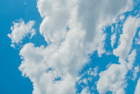 Blue sky with white clouds. Sky background.