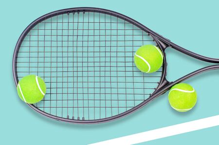 Tennis racket and ball sports on pastel blue backgroundの写真素材