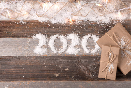 Happy New Year 2020 holiday. Christmas decoration and gifts. Background with 2020 snow figures