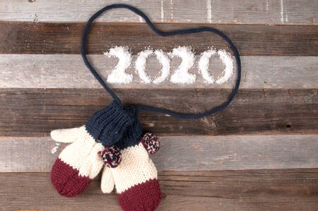 Happy New Year 2020 Christmas mood, winter warm knitted mittens.の写真素材
