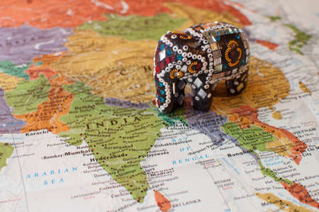 Close-up of Indian Elephant Trinket on Mapの写真素材