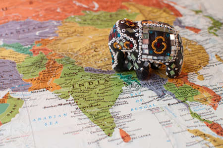 Close-up of Indian Elephant Trinket on Mapの写真素材