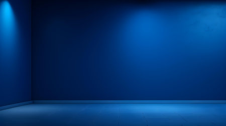 Blue wall with beautiful lighting. Elegant minimal background for product presentation.の素材