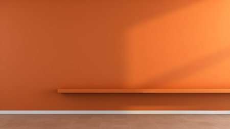 Orange wall with beautiful lighting. Elegant minimal background for product presentation.の素材