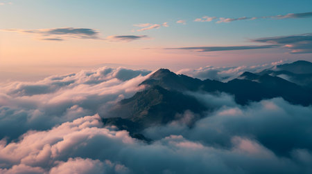 Mountain Peak Emerging above Sea of Clouds at Dawnの素材