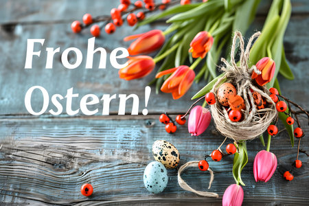 'Happy Easter!' Typography on a blue wooden background with spring flowers. Beautiful Easter Card Templateの素材