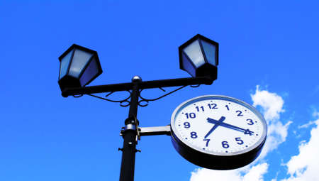 The most widespread measuring device - hours on a background of the bright dark blue sky.                    の写真素材