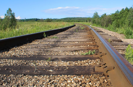 The old railway; misses in long expectation of trains; passengers and cargoes.        