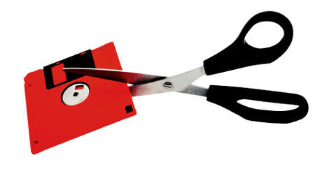 The flexible disk and scissors on the white background, the out-of-date technology of storage of the information - is a subject to recycling.                 の写真素材