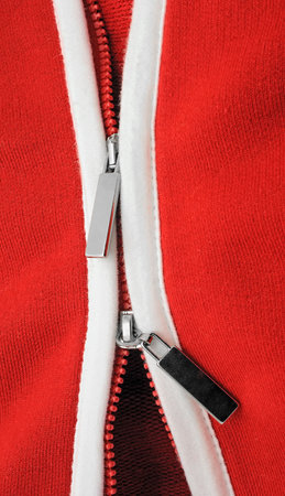 Masculine sporting jumper of red color with the double fastening of type lightning.                の写真素材