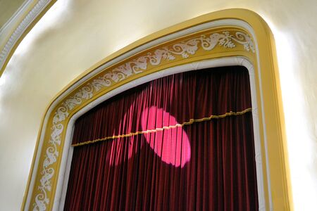 stage with red curtain and stage lights before the concertの写真素材