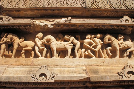 So-called erotic Hindu temple displays carvings of Kamasutra like love scenes in Khajuraho, Indiaの写真素材