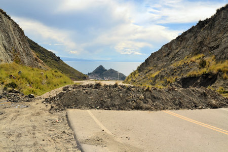 Road at lake Titicaca is blocked by rock and debris for political reasons on the altiplano near Copacabana, Boliviaの写真素材