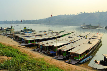 Boats on beautiful Mekong river in Laos. Mekong is one of the most important river in Indochina and South East Asiaの写真素材