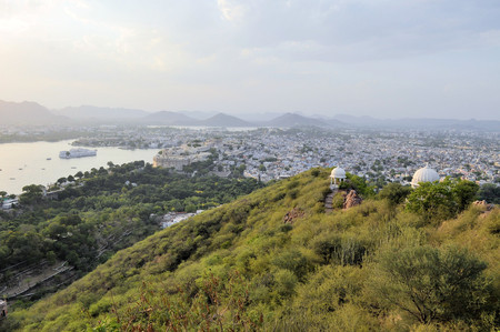 A view of Udaipur city palace at the shores of Pichola lake in Udaipur, Rajasthan, Indiaの写真素材