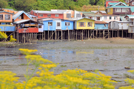 Palafitos in Castro. Castro is the capital of Chiloe Province, in the Los Lagos Region, Chile. Palafitos are houses raised on piles over the surface of the soil or a body of waterの写真素材