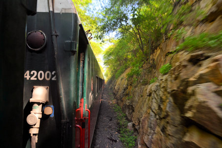 An eastbound Mexican passenger train winds its way up thr Copper Canyon, climbing 6500 in a matter of 150 milesのeditorial素材