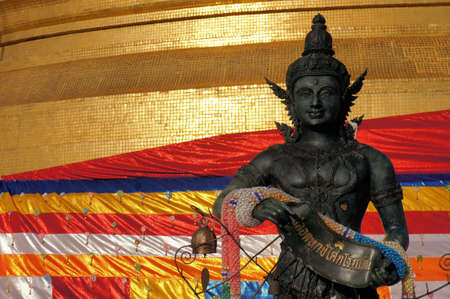Angel statue with Golden stupa religious icon of Wat Saket, golden mount in Bangkok of Thailandの写真素材