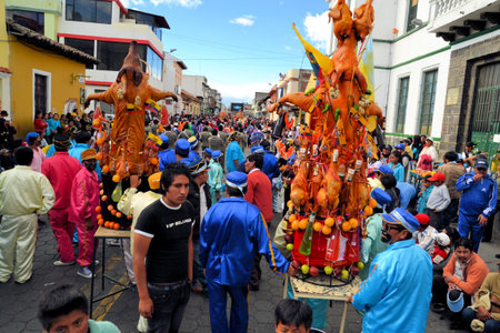 Latacunga, Ecuador 30 September, 2012: Unidentified participants take a break from parading pigs adorned with fruits, spirits, flags and guinea pigs at La Fiesta de la Mama Negra traditional festival.  Mama Negra Festival is a mixture of indigenous, Spaniのeditorial素材