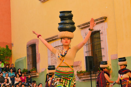 Zacatecas, Mexico, 02 August 2013: Canadians with Philippino roots perform traditional Muslim dances involving the balancing of baskets from the Southern island of Mindanao at the 18th Festival Cultural Internacional Zacatecas del Folclor. It is the biggeのeditorial素材
