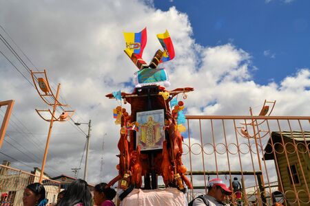 Latacunga, Ecuador 30 September, 2012: Detailed view of pig adorned with fruits, spirits, flags and guinea pigs at La Fiesta de la Mama Negra traditional festival.  Mama Negra Festival is a mixture of indigenous, Spanish and African influences and celebraのeditorial素材