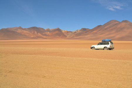 Uyuni, Bolivia - 28 November 2012: Tourist jeep in a location called Dali's desert in Eduardo Avaroa National Park. Southwestern Bolivia is well-known for dramatic landscapes, lagunas, geysirs desert and volcanoesのeditorial素材
