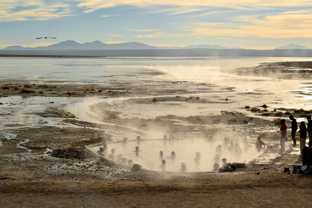Uyuni, Bolivia - 28 November 2012: Tourists take a pathin hot springs in Eduardo Avaroa National Park. Southwestern Bolivia is well-known for dramatic landscapes, lagunas, geysirs, desert and volcanoesのeditorial素材