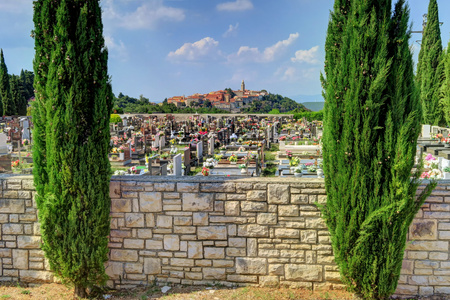 A colorful cemetery, with Labin, Croatia, in the backgroundの写真素材