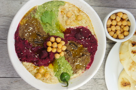 Various Flavors of hummus (beet with balsamic vinegar, jalapeno and cilantro, and cricket flour)の写真素材