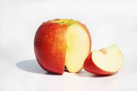 Beautiful and shiny apple, with its cut quarter, evoking fruit, nature, seine nutrition, sweetness,...
