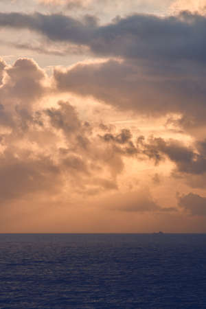 Clouds and Sunrise over the northern seaの写真素材