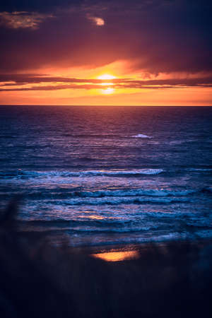 Colorful Sunset at the coastの写真素材