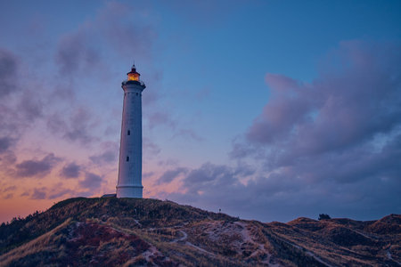 white Lighthouse in the dunes of the danish north sea coastの写真素材