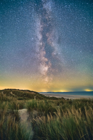 Milky Way over the dunes of the danish north sea coastの写真素材