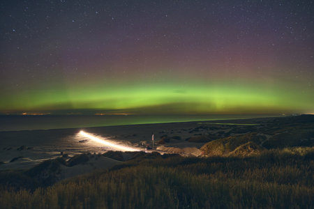 Aurora Borealis over the beach at danish Coastの写真素材