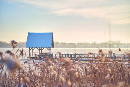 Hut for Bird watching on frozen lake in Hemmelsdorf, northern Germanyの写真素材